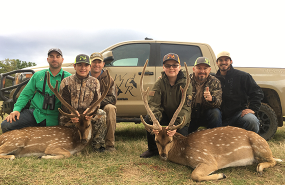 Kids showing the deer the just hunted