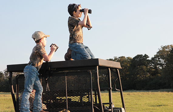 Kids using binoculars